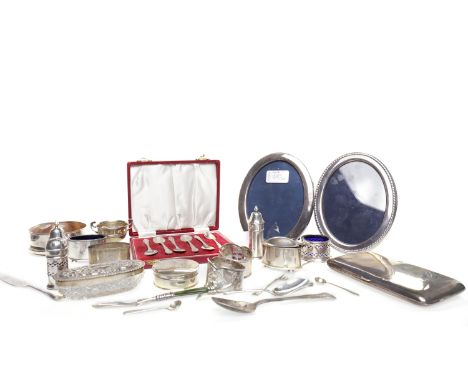 COLLECTION OF SILVER OBJECTS including a cased set of six coffee spoons, wine slide, two silver framed photograph frames, nap