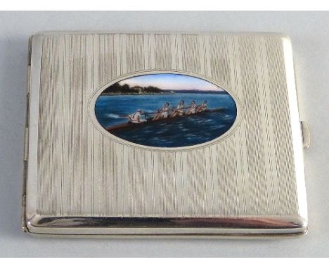 A cigarette case, of engine turned oblong form, the hinged lid inset with an oval enamelled panel of a rowing scene, monogram