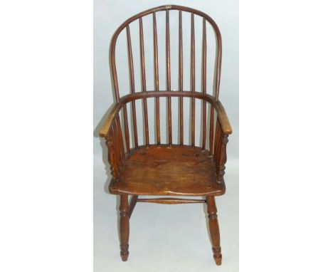 An ash and elm Windsor armchair, having high hoop stick back, baluster end arm supports and turned legs joined by H-stretcher