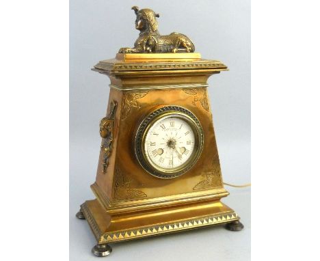 A 19th century brass mantel clock case, with 20th century electric movement the enamel dial with Roman numerals inscribed How