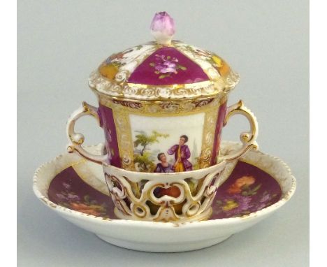 A Dresden chocolate cup with lid and trembleuse saucer, of two handled form each painted with alternate panels of lovers in a