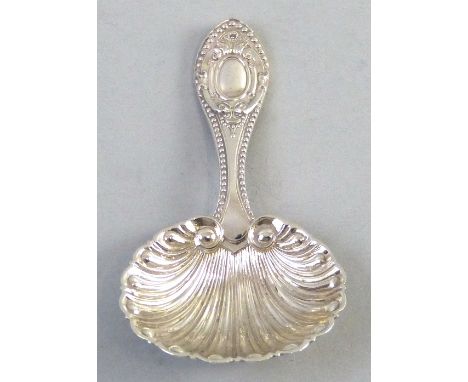 An Edwardian Caddy spoon, with shell bowl and ornate embossed handle, Sheffield 1902