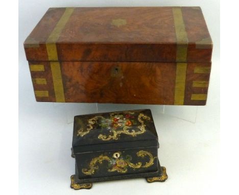 A Victorian walnut writing slope, of oblong form with brass strapwork inlay and corners, the hinged lid opening to reveal a f