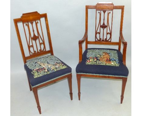 A set of five Edwardian salon chairs, including one elbow chair, each with satinwood cross banding, the elbow chair having sp