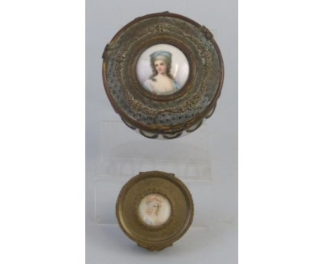 A 19th century French dressing table jar, of drum shaped form the clear glass body with gilt metal mounts and swags, the dome