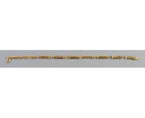 A 9ct gold gate bracelet, comprising nine pierced panels, 20cm long 4.80gms, boxed
