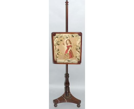 A William IV mahogany pole screen, the oblong needlework panel depicting a young girl in an garden scene within a carved fram