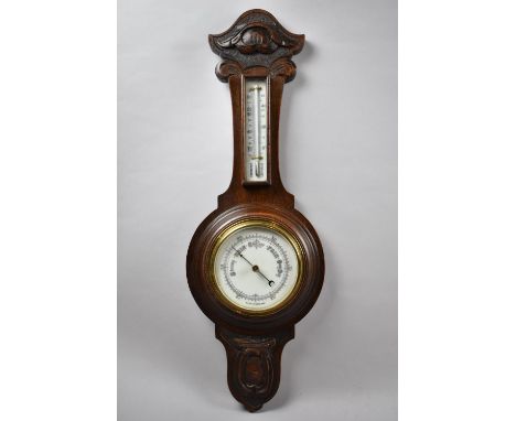 A Late Victorian Oak Framed Aneroid Wheel Barometer with Thermometer, 63cm high 