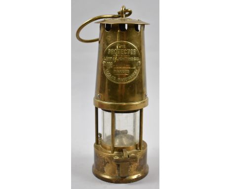 A Brass Miner's Safety Lamp by the Protector Lamp and Lighting Co., 26cm high 