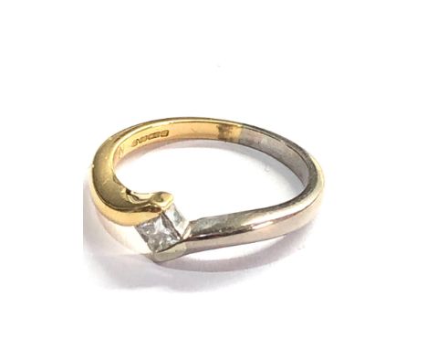 18ct white and yellow gold crossover diamond ring set with emerald cut diamond weight 3.8g 