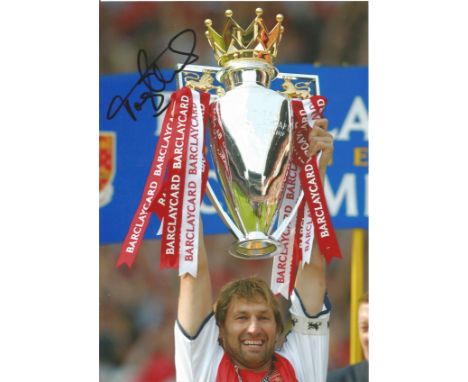 Tony Adams Signed Arsenal 8x12 Photo. Good condition. All autographs come with a Certificate of Authenticity. We combine post
