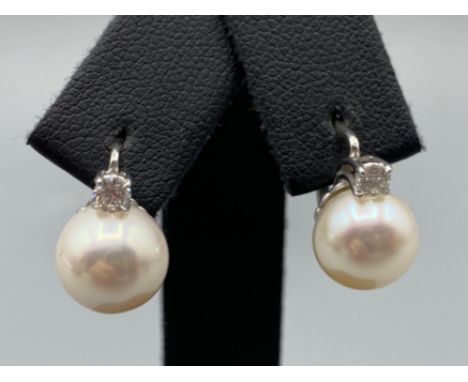 18ct White Gold Slight Drop Pearl and Diamond Earrings 0.21ct diamonds in total weighing 5.10 grams 