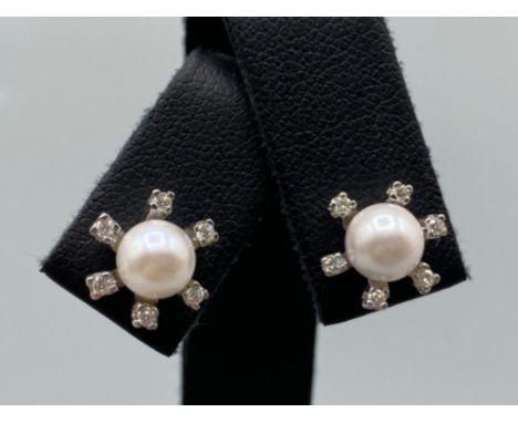 Beautiful Pearl Studs each surrounded by 6 small diamonds - 0.10cts total weighing 4.36 grams 