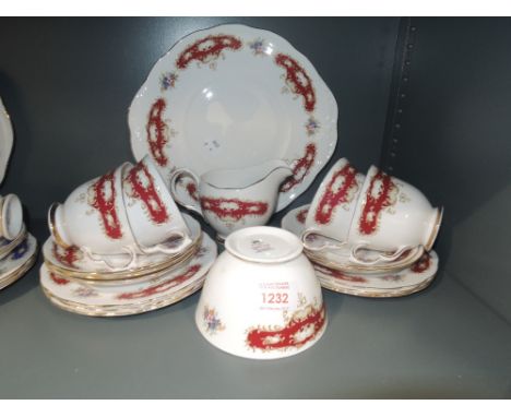 A part tea service by Queen Anne in a burgundy and gilt pattern