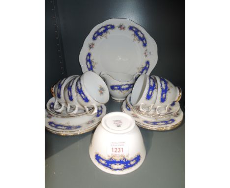 A part tea service by Queen Anne in a blue and gilt pattern