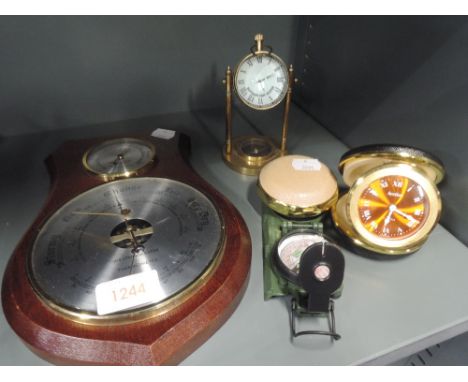 A selection of clocks, a barometer and compass