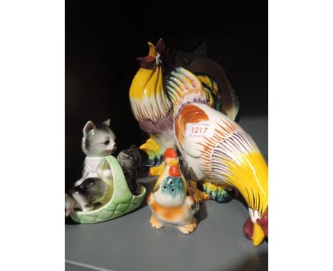 A selection of ceramic chicken and hen figures including cruet set