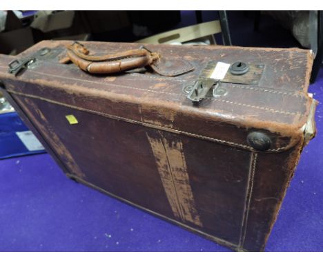 A leather bound travel trunk or suitcase