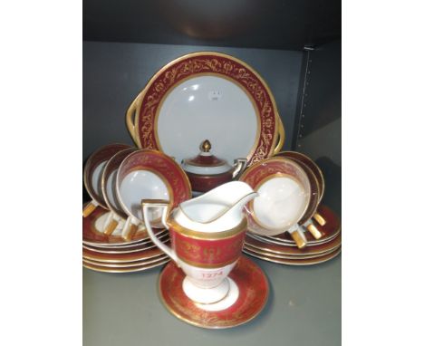 A part tea service by Royal Tettau with red and gilt design