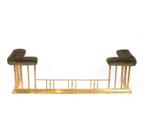 A brass and buttoned upholstered club fender, 153cm long