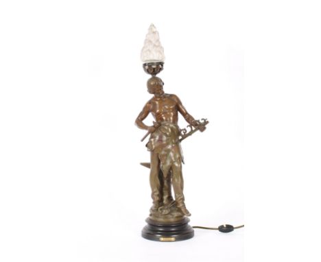 After Augustus Moreau, Spelter table  lamp base in the form of "Forgeron", surmounted by a glass flambe shade, 66cm high