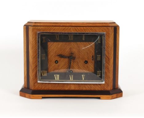 An Art Deco oak and ebony chiming mantel clock