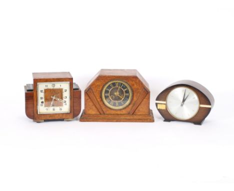 An oak cased Art Deco mantel clock, with eight day striking movement; a walnut cased Art Deco mantel clock with chiming movem