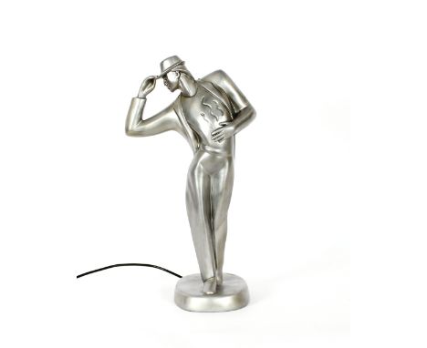 A silvered table lamp, in the form of a stylised gentleman, 50cm high