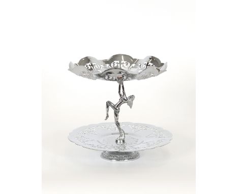 A chrome Art Deco style two tier cake stand, supported by a nude dancing girl