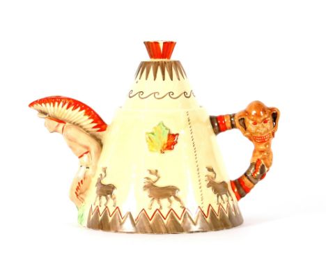 A Clarice Cliff teapot, stamped to the base "Greetings From Canada", decorated Red Indians and deer 