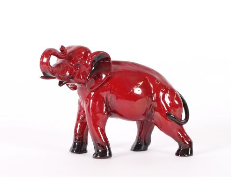 A Royal Doulton flambé model of an elephant, 18cm long - trunk  AF
