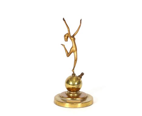 An Art Deco style match striker, after Lorenzl, in the form of a nude girl balanced on a ball, 24cm high