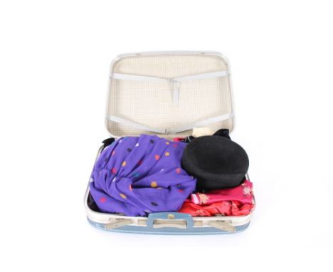 A suitcase, containing vintage dresses etc. including Carnegie of London