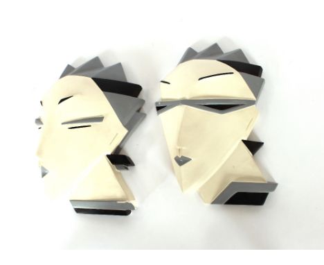 A pair of Art Deco style wall masks, one AF