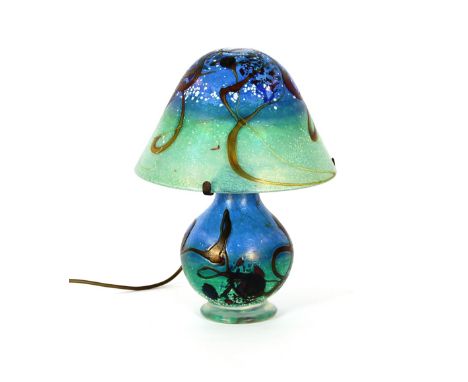 A Tiffany design coloured glass lamp, having mushroom shade and baluster body, 37cm high