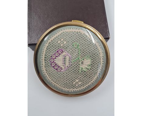 A Vintage Enamel Compact. Woven floral design on lid.7cm diameter. Good Condition. 