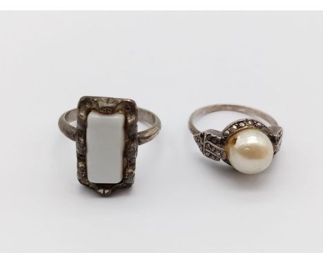 Two Antique Ladies White-Metal Rings. A Pearl - Size I and a White Enamel - Expandable. 