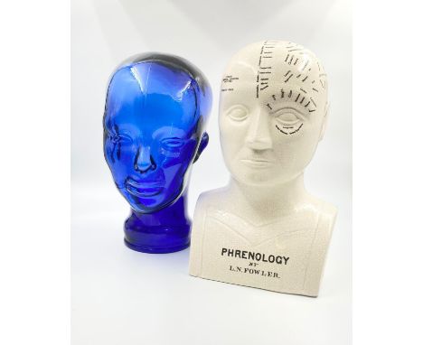 Two Heads for the Price of One! A cobalt blue glass head - 15 x 30cm and a ceramic phrenology head by L.N. Flower -17 x30 cm.