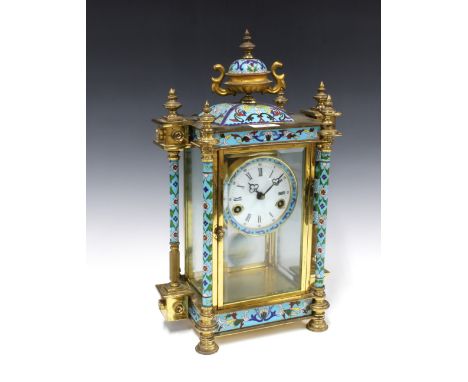 Cloisonne, brass and glass cased mantle clock, surmounted by an urn finial, enamel dial with roman numerals, striking on a go