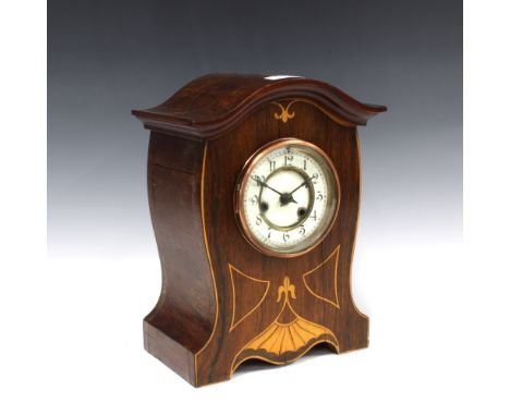 Mahogany and satinwood inlaid mantle clock, arched top over a dial with enamel chapter ring with Arabic numerals, 31cm 