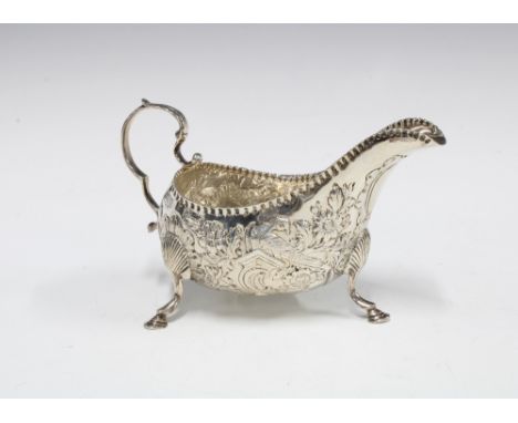 Edwardian Irish silver cream jug, with birds and flower decoration, West &amp; Son, Dublin 1903, 15cm long 
