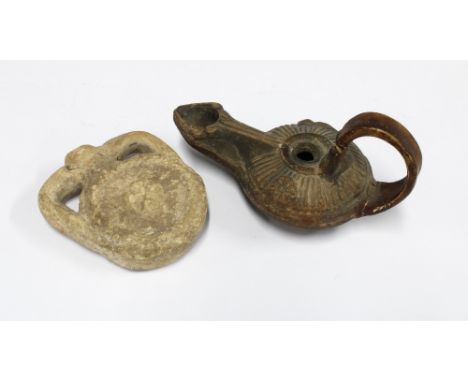 Votive oil flask, 7.5cm high,  and a small oil lamp (2) 