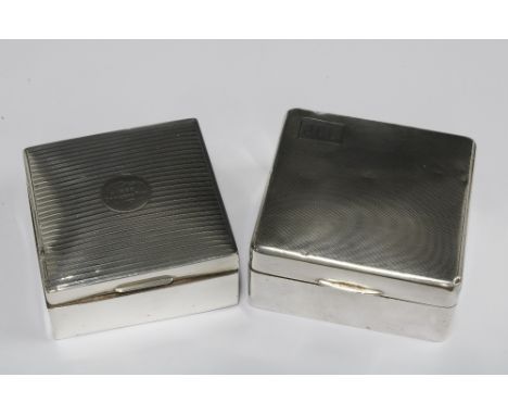 Two silver cigarette boxes, one with 1922 inscription and the other with Birmingham 1934 hallmarks, 9 x 9cm (2) 