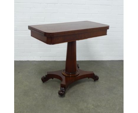 Mahogany foldover card table, baize interior, raised on a tapering cylindrical column with a  platform base and scroll feet, 