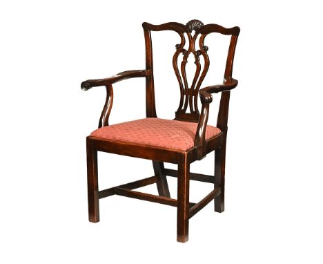 A Georgian mahogany Chippendale style armchair, with shell carved top rail, pierced splat back and drop in seat raised on leg