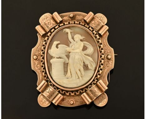 A large 9 ct gold cameo brooch, with safety chain.  55.3 grams gross. 8 cm x 6.8 cm (see illustration).