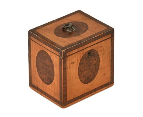 A George III satinwood and crossbanded tea caddy, with lead lined interior.  Height 12 cm, width 12 cm, depth 9.5 cm. CONDITI