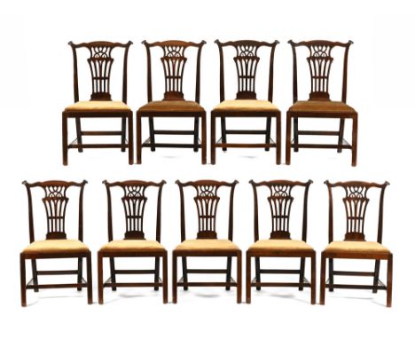 A set of nine Edwardian mahogany Chippendale style dining chairs, each with yoke shaped top rail, pierced splat backs and dro