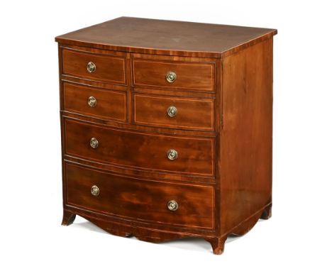 A Georgian mahogany and boxwood strung commode cabinet, in the form of a bowfronted chest, with brass drop handles and circul