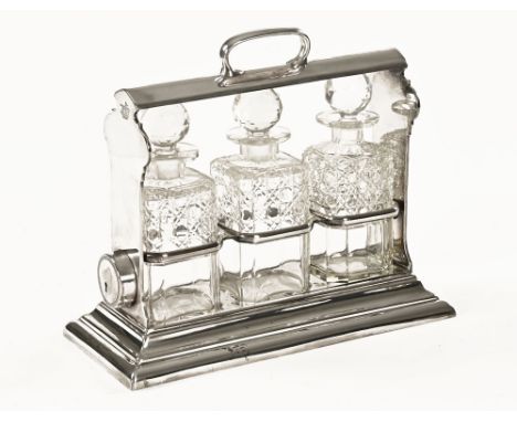A Walker & Hall three decanter silver plated tantalus stand.  Length 38 cm. CONDITION REPORT: We do have the key for the tant